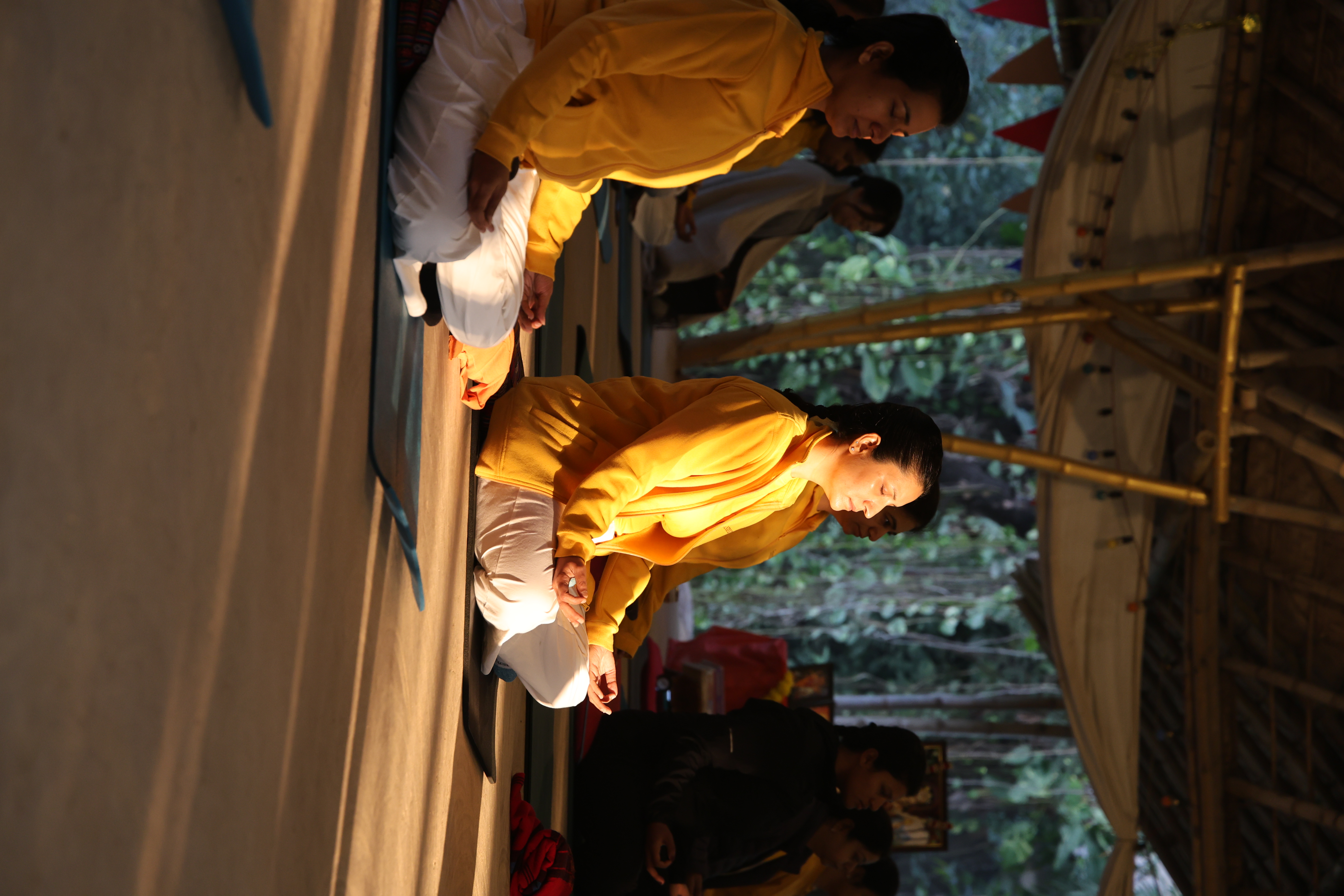 Sivananda students meditating in morning light