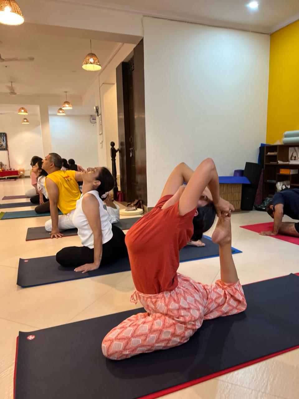 Students practising yoga in person at Sivananda Yoga Centre Gurgaon